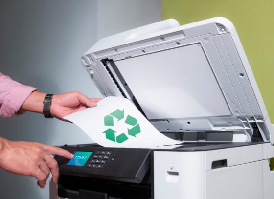 Image of printer printing recycling logo