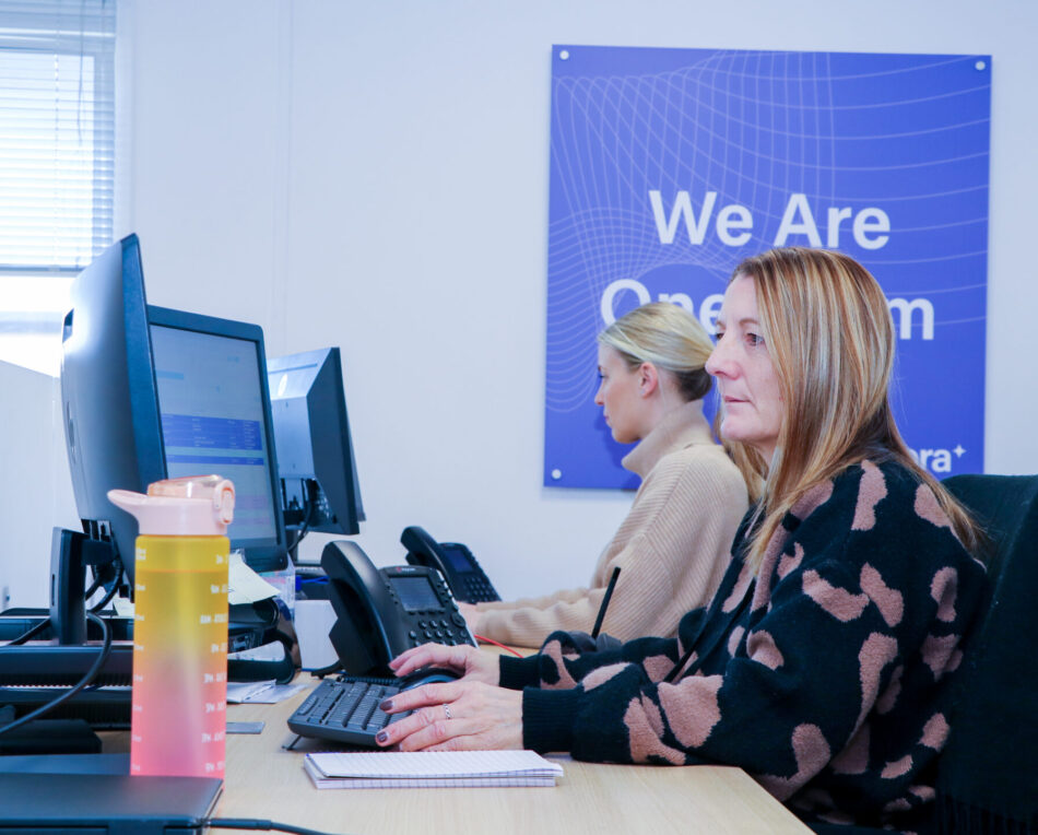 image of two ladies working at a computer